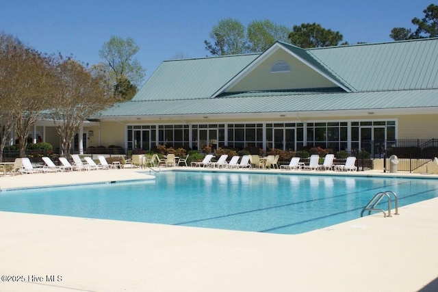 view of pool featuring a patio