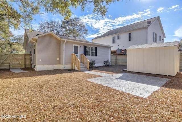 rear view of property featuring a patio area