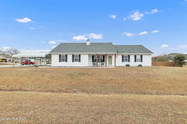 single story home with a carport, covered porch, and a front lawn