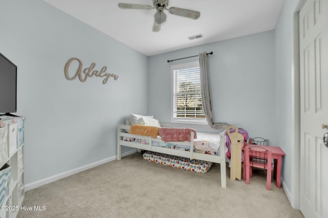 bedroom with ceiling fan and light carpet