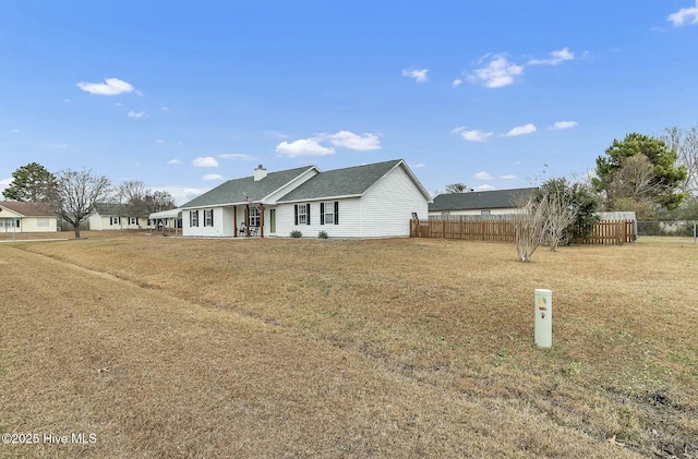 single story home featuring a front yard