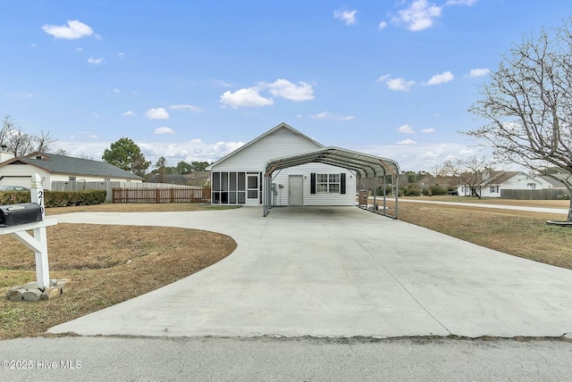 ranch-style home with a carport and a sunroom