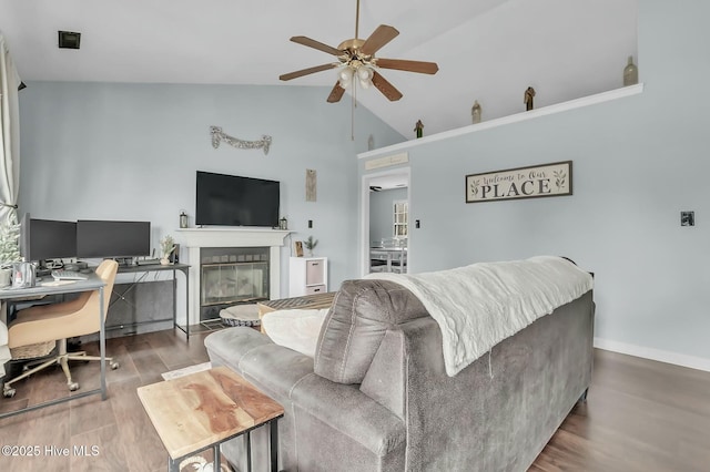 living room with wood-type flooring, ceiling fan, and lofted ceiling