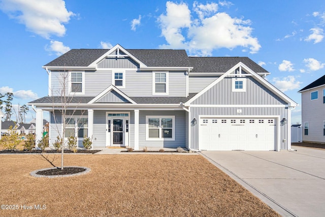 craftsman inspired home with a front lawn and a garage