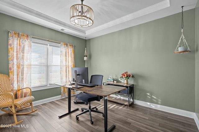 home office with hardwood / wood-style flooring, a wealth of natural light, and a tray ceiling