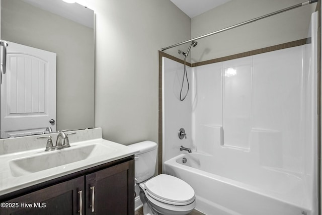 full bathroom with vanity,  shower combination, and toilet