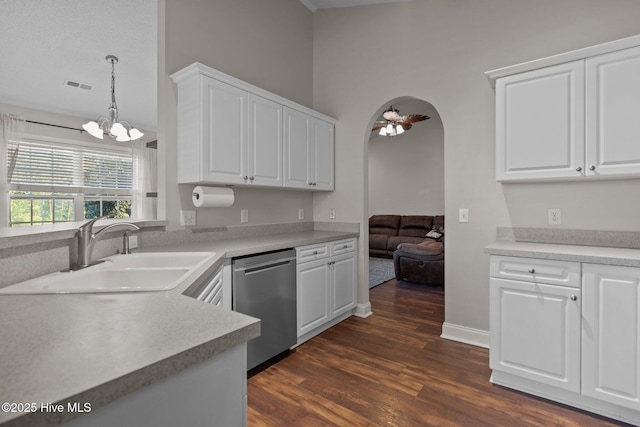 kitchen featuring white cabinetry, stainless steel dishwasher, hanging light fixtures, and sink