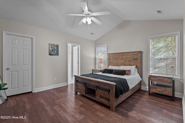 bedroom with dark hardwood / wood-style floors, ceiling fan, and lofted ceiling