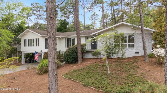 565 Lake Forest Dr SE, Pinehurst, NC 28374 - ranch-style home featuring crawl space and a carport