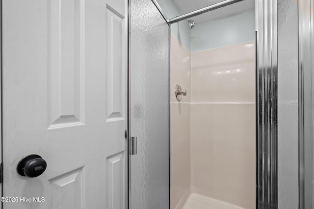 bathroom featuring an enclosed shower