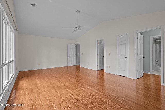 interior space with light hardwood / wood-style floors, vaulted ceiling, ceiling fan, and a healthy amount of sunlight