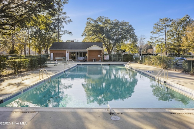 view of swimming pool with a patio area