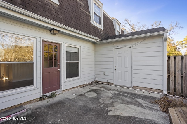 property entrance with a patio area