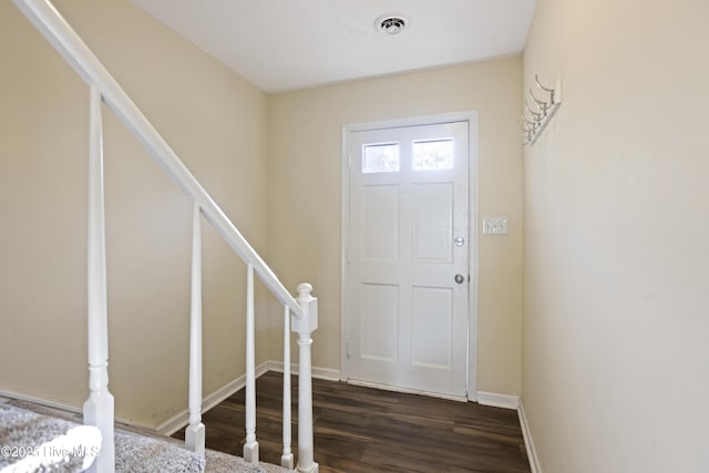 foyer with dark wood-type flooring