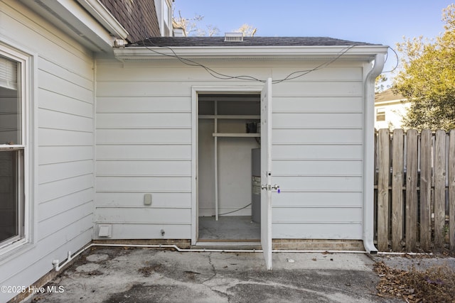 entrance to property with a patio area and electric water heater