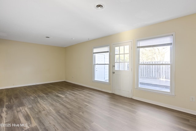 spare room featuring hardwood / wood-style flooring