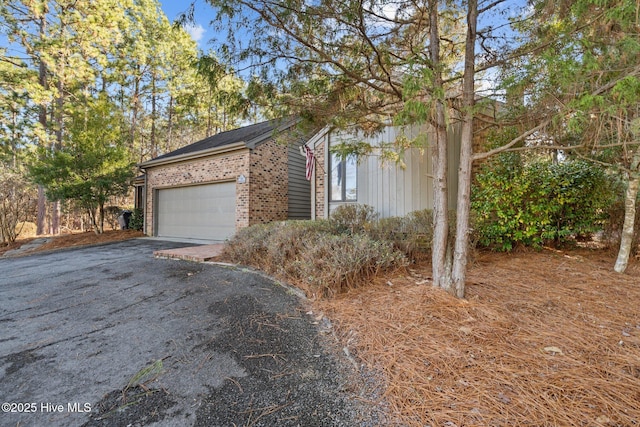 view of side of property featuring a garage