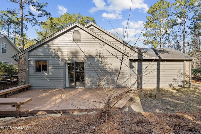 rear view of house with a wooden deck