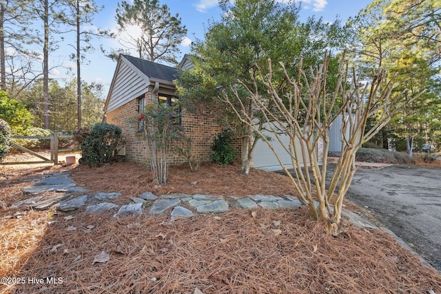 view of side of property featuring a garage