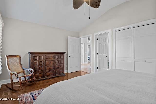 bedroom with a closet, ceiling fan, lofted ceiling, and dark hardwood / wood-style floors