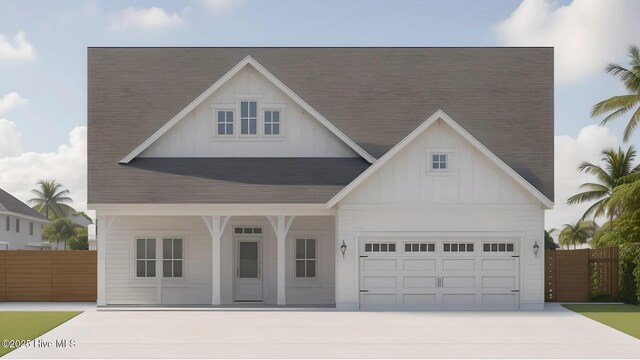 125 E Singing Ave, Hampstead, NC 28443 - view of front facade featuring covered porch