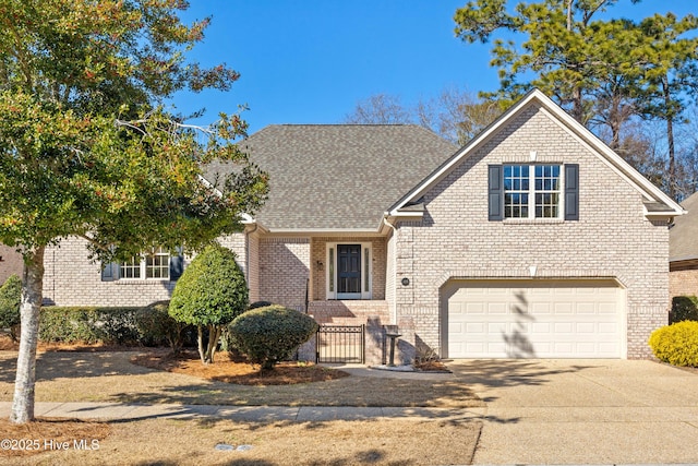 view of front of property with driveway, brick siding, an attached garage, and a shingled roof