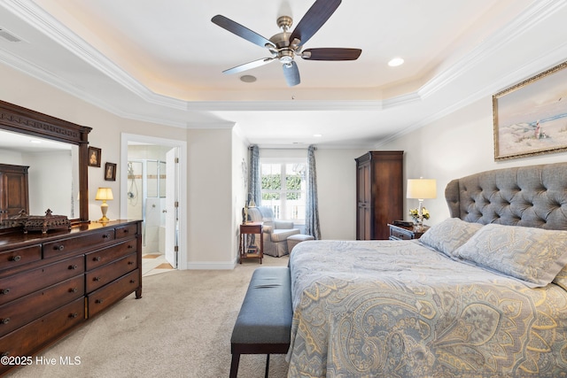 carpeted bedroom with crown molding, ceiling fan, and a tray ceiling