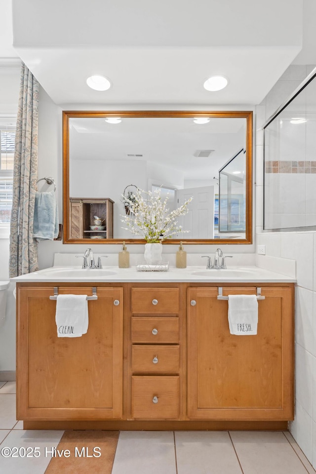 bathroom with vanity and tile patterned floors