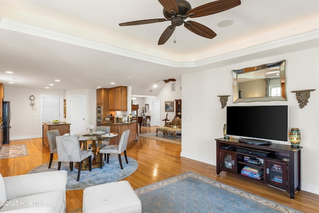 dining room with ceiling fan and light wood-type flooring