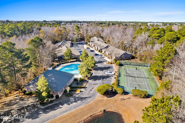 aerial view featuring a wooded view