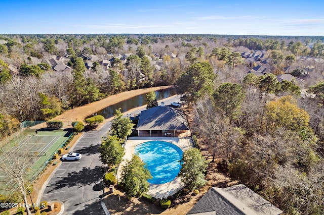 bird's eye view featuring a water view and a forest view