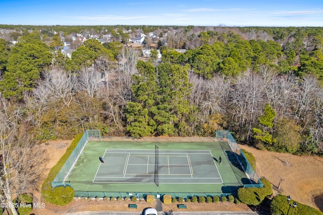 drone / aerial view featuring a view of trees