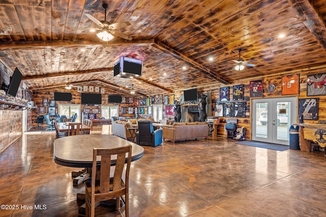 dining area featuring french doors, lofted ceiling with beams, a wealth of natural light, and wooden ceiling