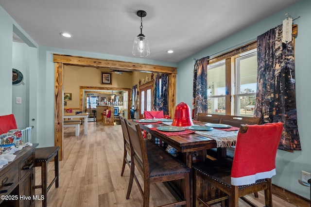 dining space featuring plenty of natural light and light wood-type flooring