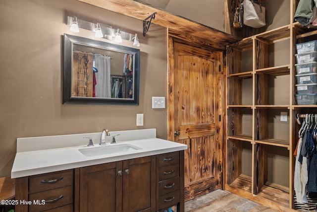 bathroom featuring hardwood / wood-style floors and vanity