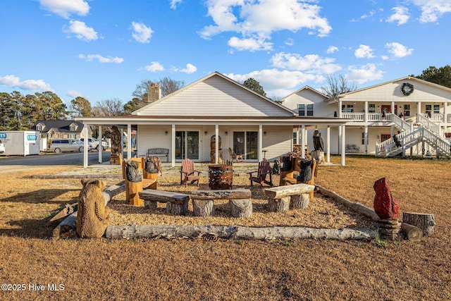 back of property featuring a porch