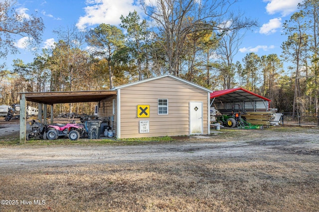 view of outbuilding featuring a carport