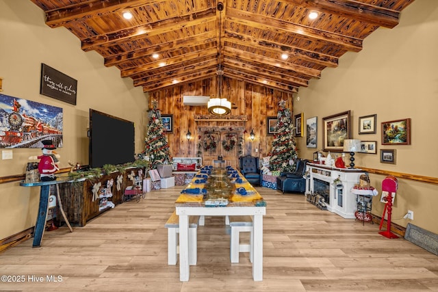 rec room featuring wooden ceiling, high vaulted ceiling, and light hardwood / wood-style flooring