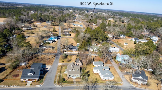 aerial view with a residential view and a view of trees