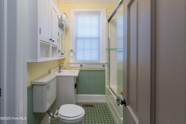 full bathroom featuring visible vents, shower / bath combination with glass door, vanity, and toilet