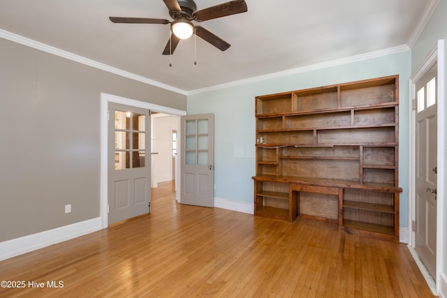 unfurnished living room featuring ornamental molding, light wood finished floors, and baseboards