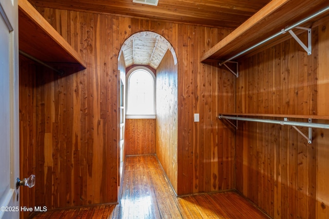 walk in closet featuring visible vents and hardwood / wood-style floors