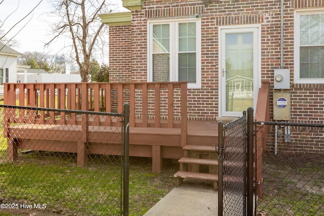 deck featuring fence and a gate