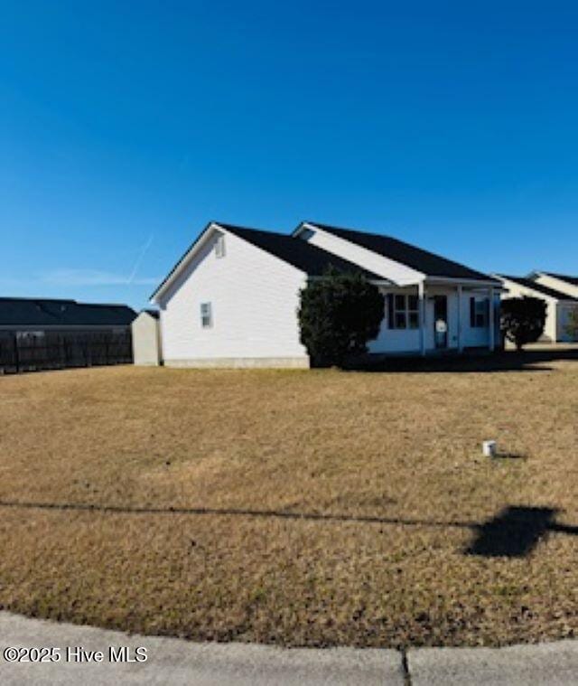 view of property exterior featuring a yard