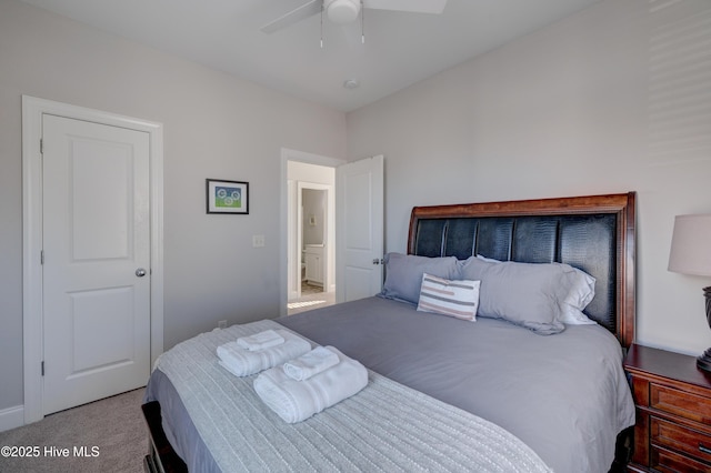 bedroom featuring light colored carpet and ceiling fan