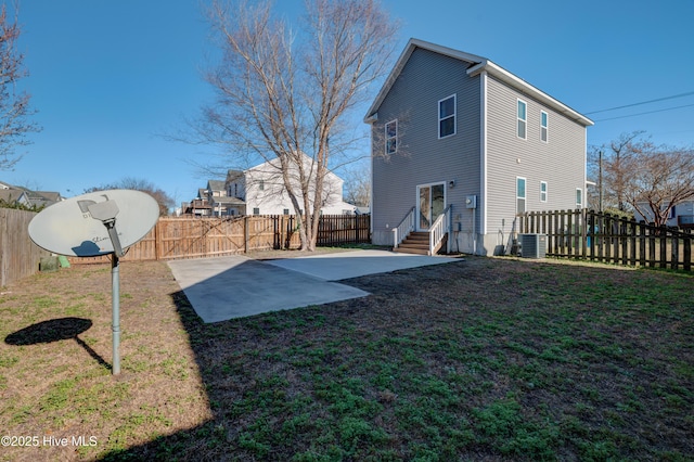 exterior space featuring a patio, central AC, and a lawn