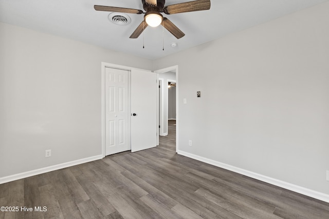 unfurnished bedroom featuring a closet, ceiling fan, and hardwood / wood-style floors