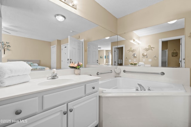 bathroom featuring vanity and a bathing tub