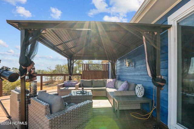 view of patio with a gazebo, a wooden deck, and an outdoor hangout area