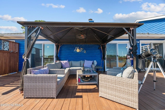 deck with a gazebo and an outdoor hangout area